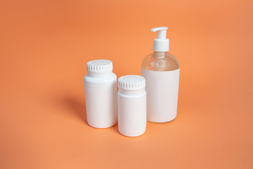 Set of cosmetic containers. white jars on a beige background