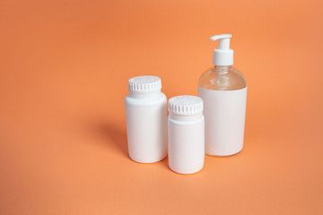 Set of cosmetic containers. white jars on a beige background