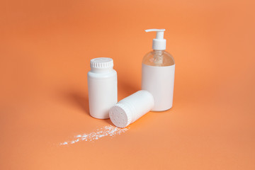 Set of cosmetic containers. white jars on a beige background