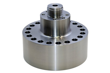 Cylindrical steel metal part with round holes made on a lathe. Metal industry products, workpieces isolated on white