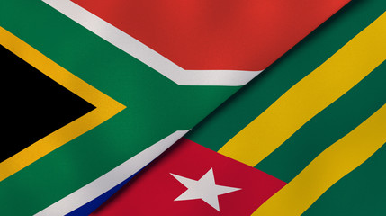 The flags of South Africa and Togo. News, reportage, business background. 3d illustration