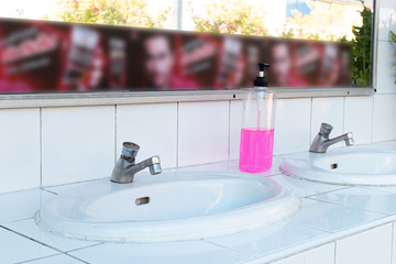 Public sinks, Handwashers for people using public toilets, Public toilets and hygiene concept.