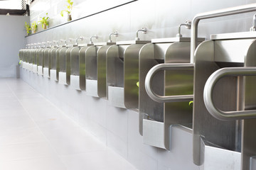 Men's white urinals design, Close up row of outdoor urinals men public toilet, Urinal concept.