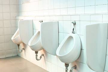 Men's white urinals design, Close up row of outdoor urinals men public toilet, Urinal concept.