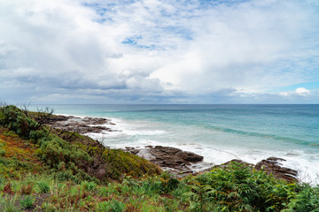 Beach waves and mountain rocks coastline. urquoise ocean sea, white sand, road trip. Travel, driving, road trip, holiday, vacation, journey, paradise. Great Ocean Road. Melbourne, Australia.
