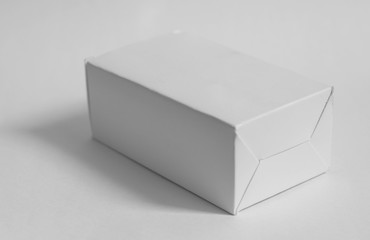 Closed white box on white background