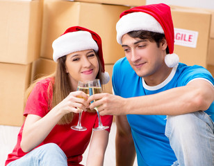 Young family celebrating christmas in new home