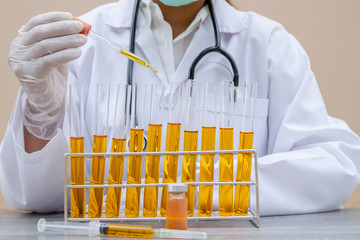 Professional doctors perform testing and analyzing samples of COVID-19 vaccines for immunization prevention and treatment from viral infections. Medical and health care concepts