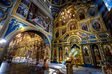 Fototapeta na wymiar Interior of the St. Michael's Golden Domed Cathedral with altar and fragments of frescoes. Kyiv, Ukraine. April 2020