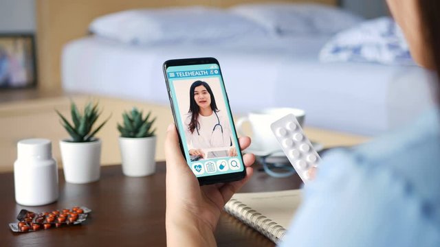4K. sick quarantine patient use remote vdo conference, make online consultation with doctor on mobile application about illness, medication via video call. Telehealth, Telemedicine and online hospital