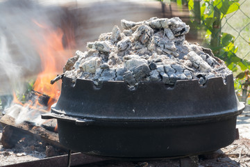 Fireplace and food preparation of traditional Croatian meal Peka.
