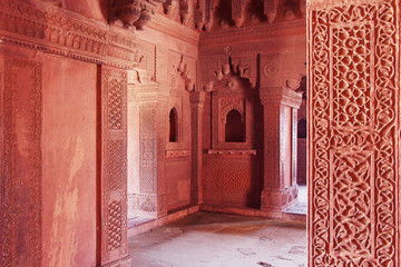 Carved indian red walls of Fatefpur Sikri Palace - UNESCO Wolrd heritage site from 16th century
