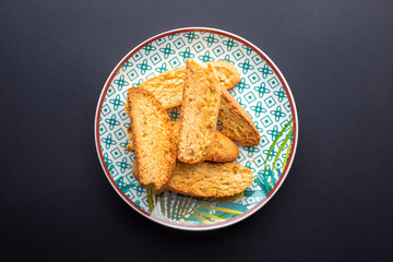 Homemade biscuits on a black background.