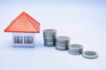 Orange roof house and coin stairs Money saving ideas for buying a home or loan for real estate investment planning and ideas for saving money may be risky.