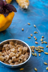 toasted slices of bread, crackers for soup with seeds in the background