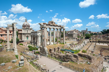 Fototapeta na wymiar View of the Roman Forum from the Capitoline Hill, Rome, showing the ruins of the Temple of Saturn in the centre of the picture.