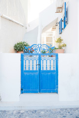 blue door in santorini greece © emerald-weddings.com