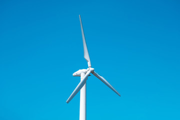 Wind turbine and clean blue sky, windmill electric turbine