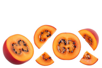 Fresh tamarillo fruit slices with leaves isolated on white background. Top view. Flat lay. Set or collection