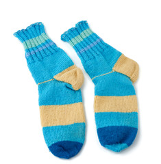 pair of striped handmade knitted warm socks made of sheep’s wool yarn