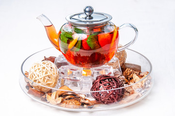 teapot with tea on a white background
