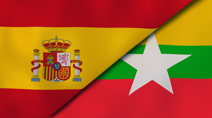 The flags of Spain and Myanmar. News, reportage, business background. 3d illustration
