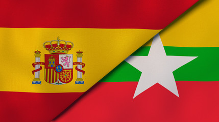 Obraz premium The flags of Spain and Myanmar. News, reportage, business background. 3d illustration