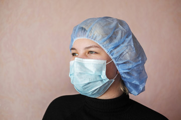 Asian woman in a protective face mask. Portrait of a young woman in a medical mask against covid-19