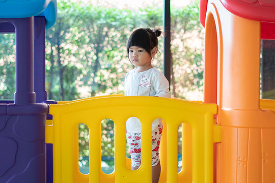 Kids Learnfrom Play With Colourful Wooden Toy On Table Top At Home. Preschool Young Girl Concentrate With Educational Equipment In Recess Term Back To School Children At Home Or Daycare Kindergarten.