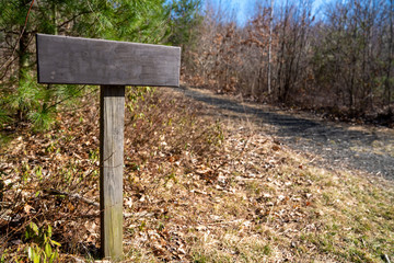 Blank Sign with room for your copy next to a path.