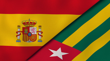 The flags of Spain and Togo. News, reportage, business background. 3d illustration