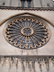 Angers, France - March 15th 2013 : detail of the facade of the cathedral Saint-Maurice. Focus on the rosace. 