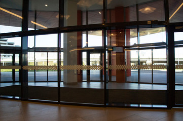 Glass doors in a mall without people. Moscow, Russia - April 14 2020