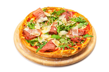 Pizza with dry cured ham, parmesan cheese, rocket and pine nuts on wooden platter, isolated  with clipping path