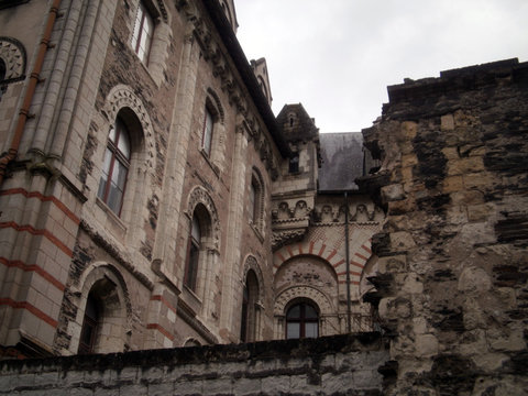 Angers, France - March 15th 2013 : Focus on the episcopal palace (Le palais du Tau), located next to the Saint-Maurice cathedral. It was built in the 12th century.