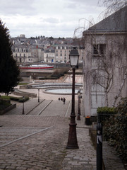 Fototapeta na wymiar Angers, France - March 15th 2013 : View of the Montée Saint-Maurice, in front of the Cathedral of the city. 