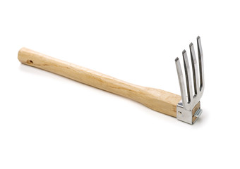 Gardening tools . Gardening rake. Gardening trowel.Metal rake for gardening on white background.