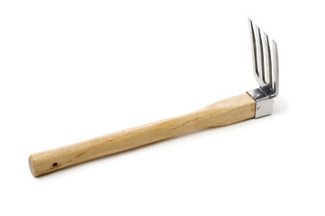 Gardening tools . Gardening rake. Gardening trowel.Metal rake for gardening on white background.