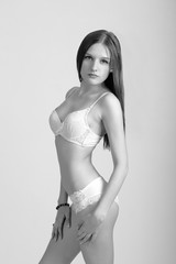 Naklejka premium Sexy woman in white lingerie gorgeous figure.