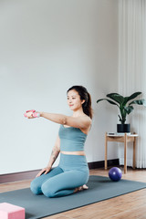 Fototapeta na wymiar young asian beauty woman doing yoga at home