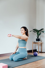 young asian beauty woman doing yoga at home