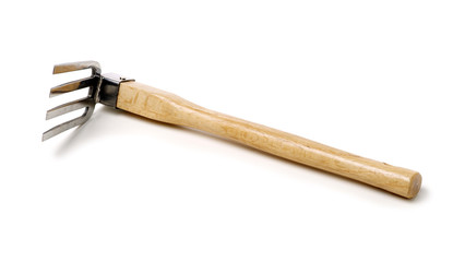 Gardening tools . Gardening rake. Gardening trowel.Metal rake for gardening on white background.