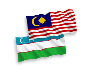 Flags of Uzbekistan and Malaysia on a white background