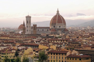 Fototapeta na wymiar View of the city of Florence Italy at sunset highlights the Duomo and the Cathedral of Florence Santa Maria del Fiore.