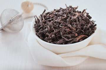 the tea bowl and tea strainer on white background