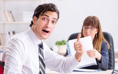 Man and woman discussing in office