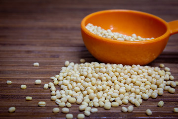 White lentils on a wooden background