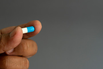 Hand and medicine Antiretroviral drug concept.