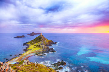 Torra di a Parata with Genoese Tower and Archipelago of Sanguinaires islands at background.