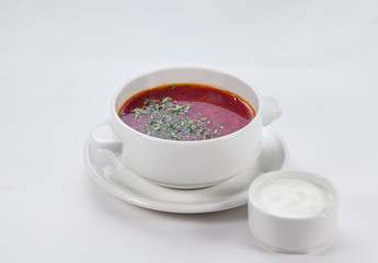 borscht in a plate on a white background